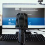 Microphone and computer monitor at office.