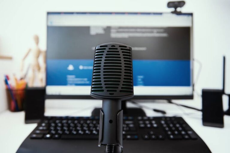 Microphone and computer monitor at office.